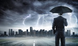 Business man With Umbrella Looking Storm Over City