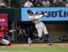 ARLINGTON, TX - OCTOBER 4: 
Aaron Judge #99 of the New York Yankees hits his 62nd home run of the season against the Texas Rangers during the first inning in game two of a double header at Globe Life Field on October 4, 2022 in Arlington, Texas. Judge has now set the American League record for home runs in a single season. (Photo by Ron Jenkins/Getty Images)